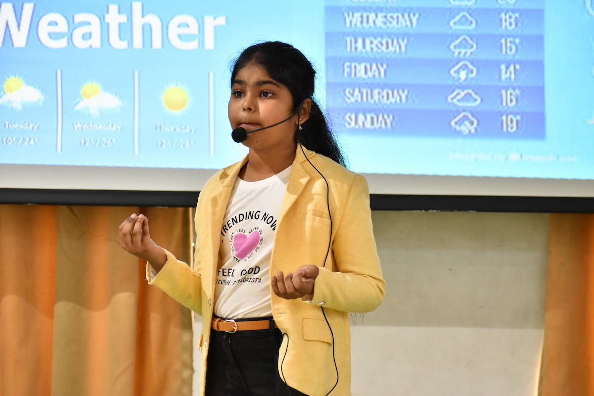 student writing on notebook