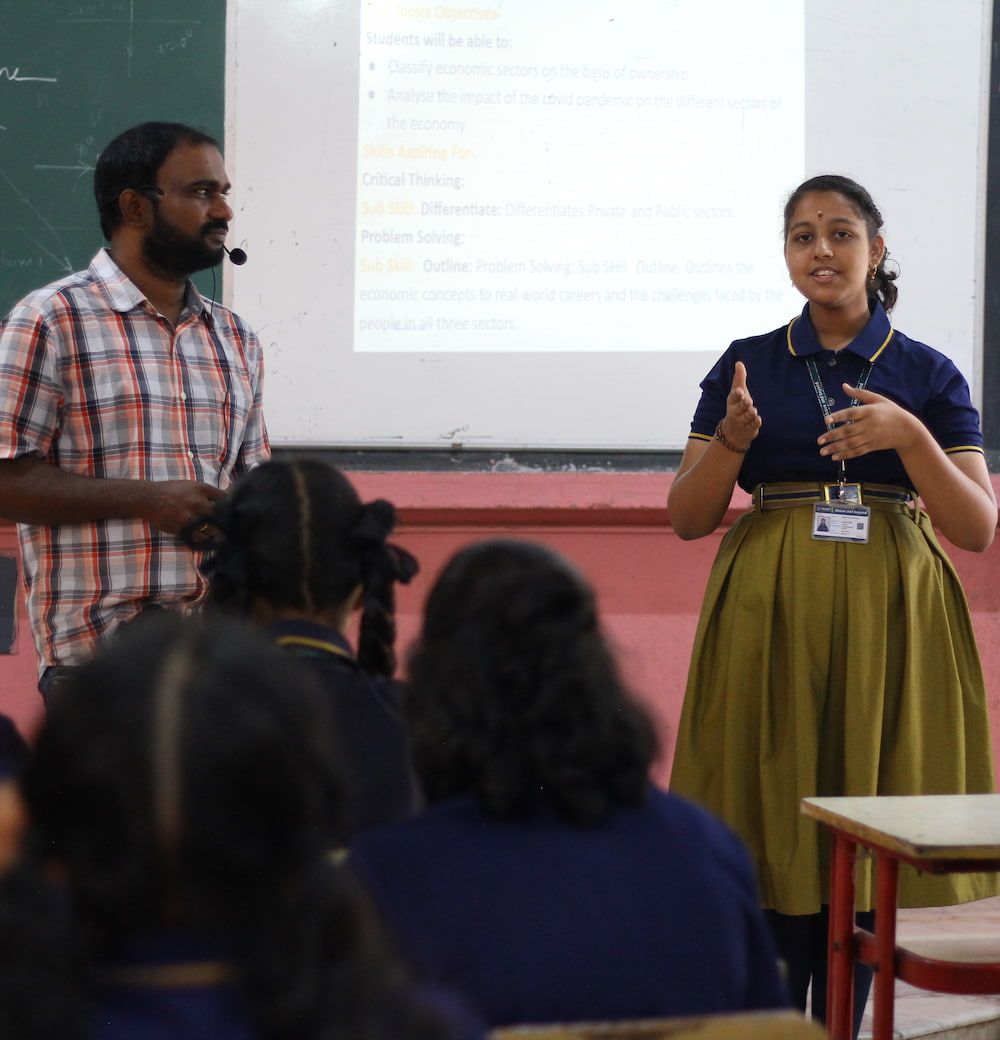 student writing on notebook