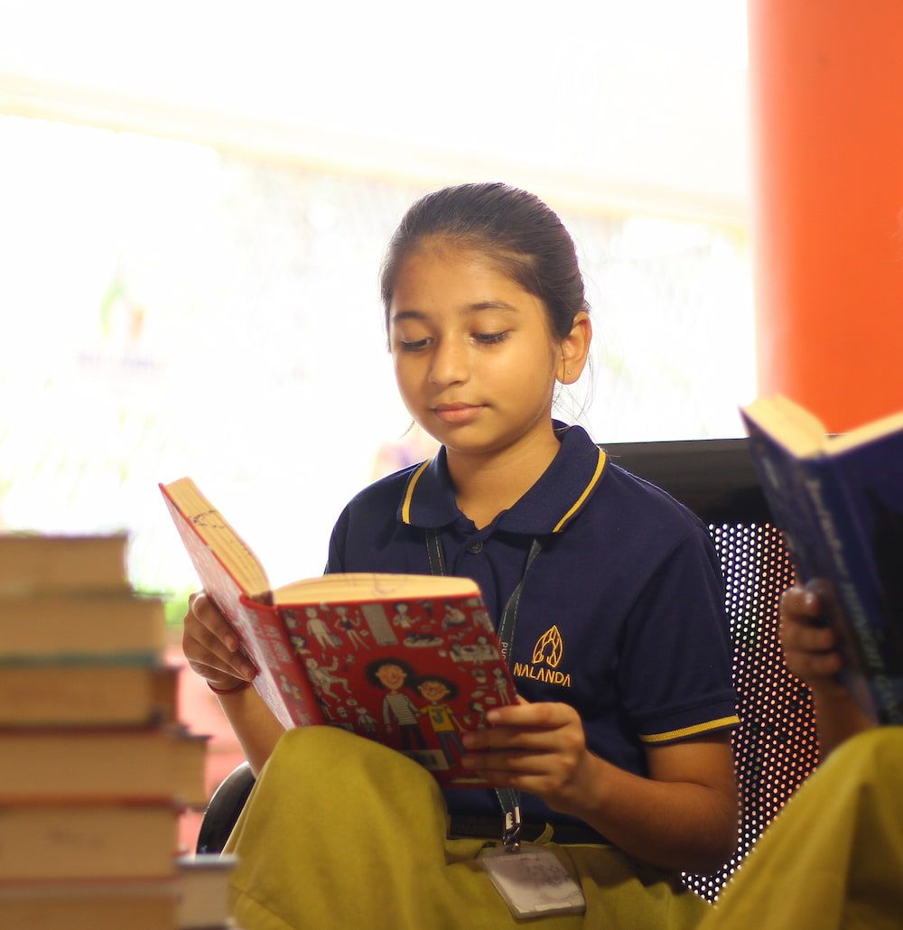 student writing on notebook