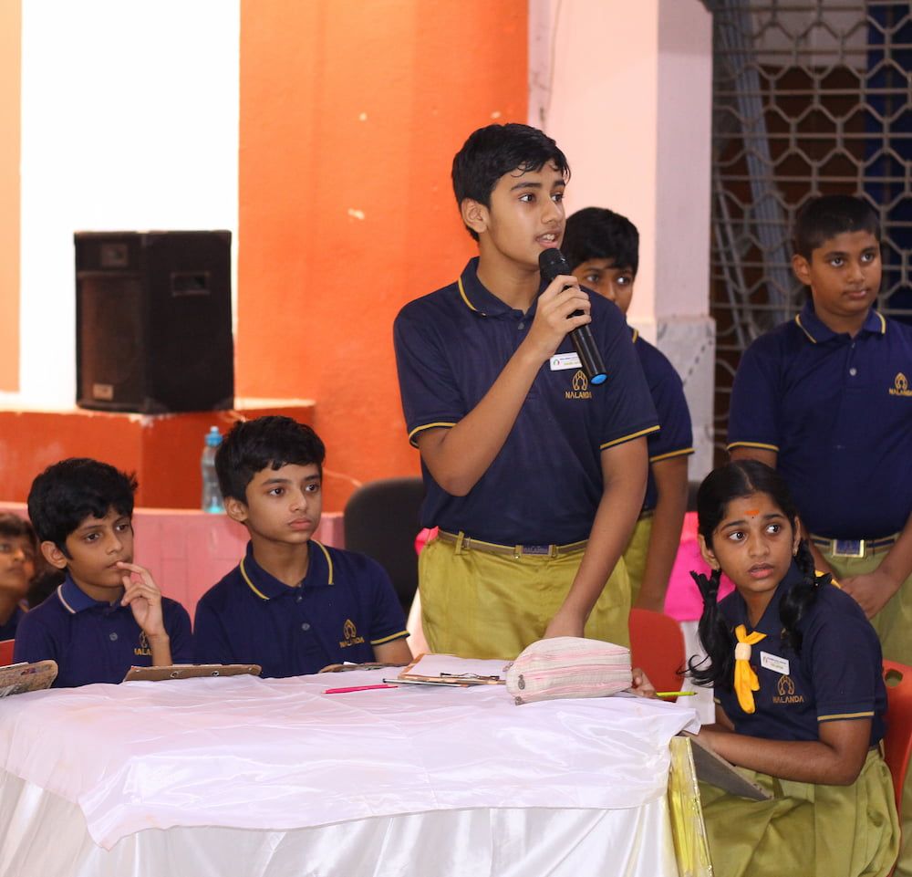 student writing on notebook