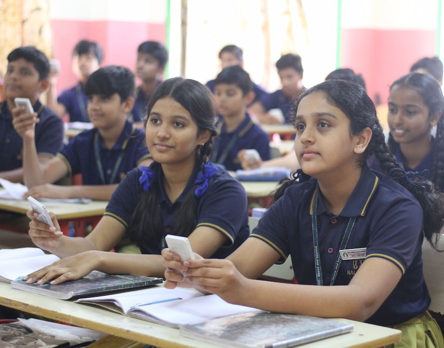 student writing on notebook