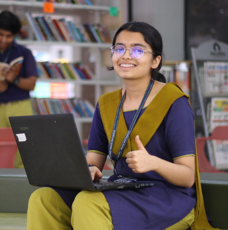 student writing on notebook