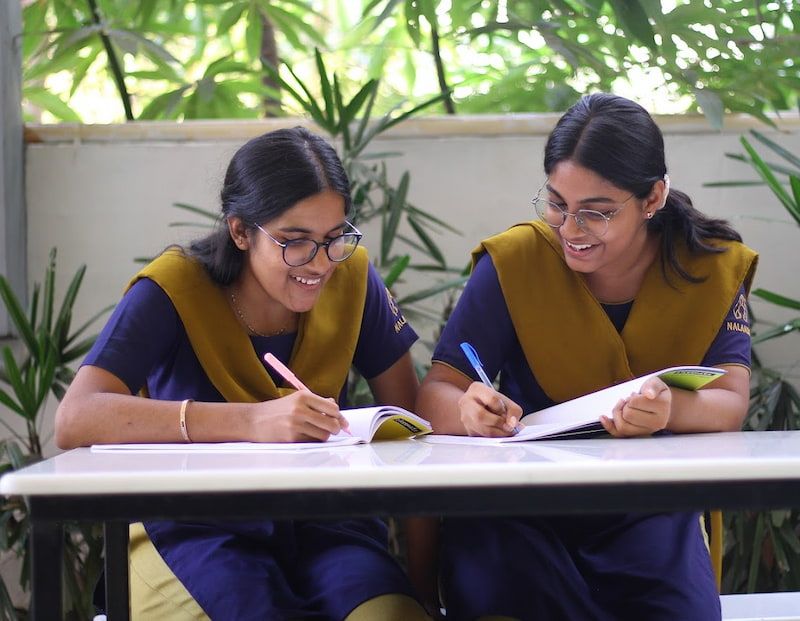 student writing on notebook